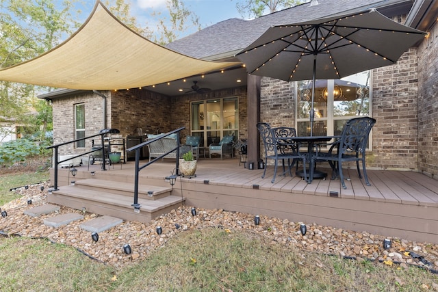 deck featuring ceiling fan and an outdoor living space