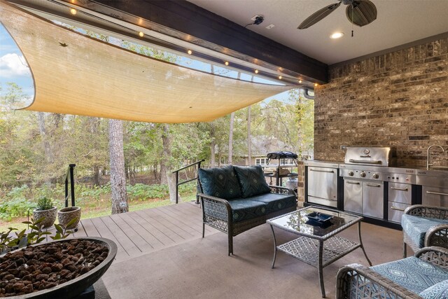 view of patio / terrace featuring outdoor lounge area, ceiling fan, area for grilling, and a deck