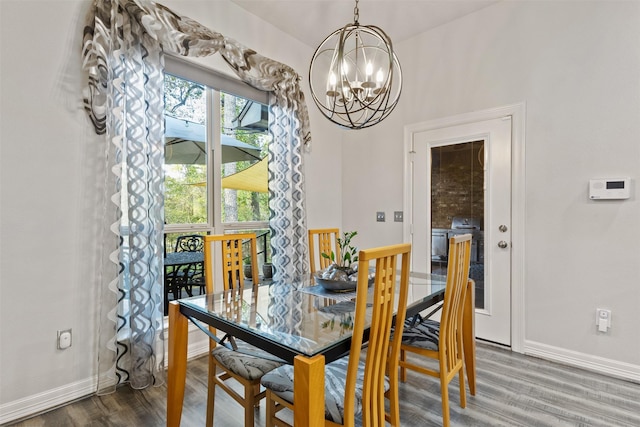 1617 Woodland Valley Dr, Huntsville, TX 77340 - dining space with hardwood / wood-style floors and an inviting chandelier
