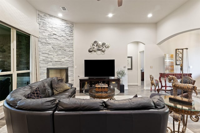 1617 Woodland Valley Dr, Huntsville, TX 77340 - living room featuring ceiling fan, a fireplace, and light hardwood / wood-style floors