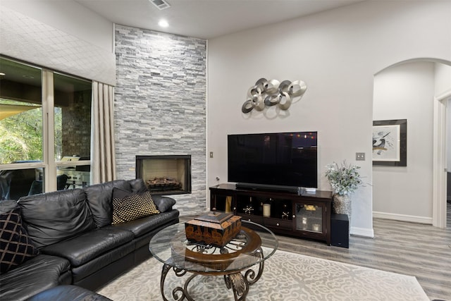 1617 Woodland Valley Dr, Huntsville, TX 77340 - living room with a large fireplace and light wood-type flooring