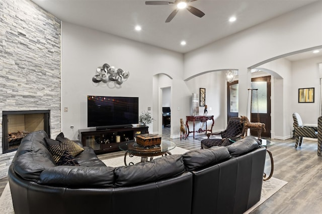 1617 Woodland Valley Dr, Huntsville, TX 77340 - living room with ceiling fan, a fireplace, and light hardwood / wood-style flooring