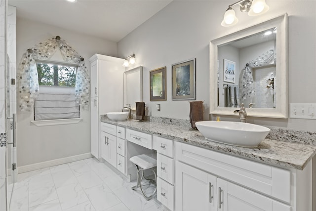 bathroom featuring vanity and a shower with shower door