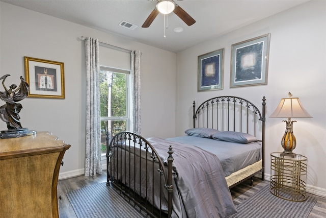 bedroom featuring dark hardwood / wood-style flooring and ceiling fan