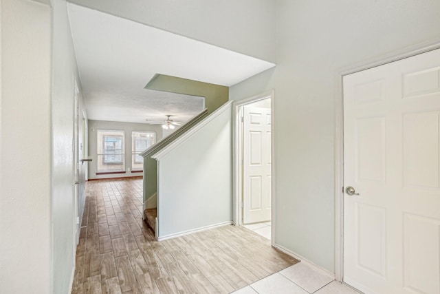 hallway with light hardwood / wood-style floors