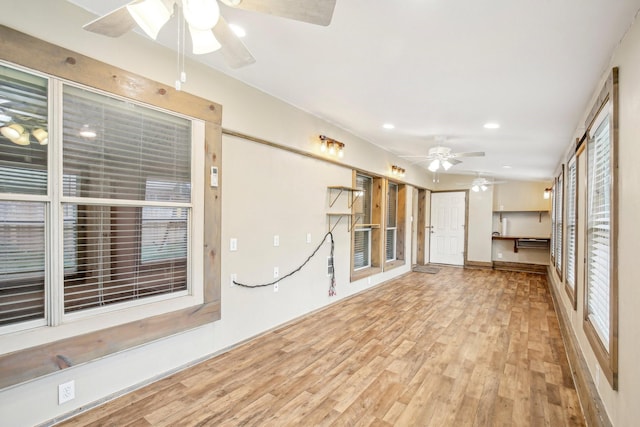 spare room featuring hardwood / wood-style floors and ceiling fan