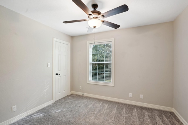 unfurnished room with carpet flooring and ceiling fan