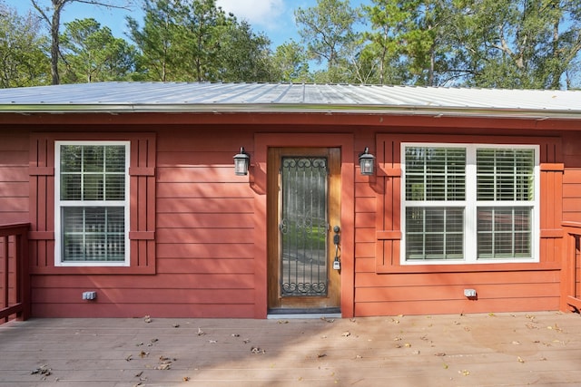 property entrance with a deck