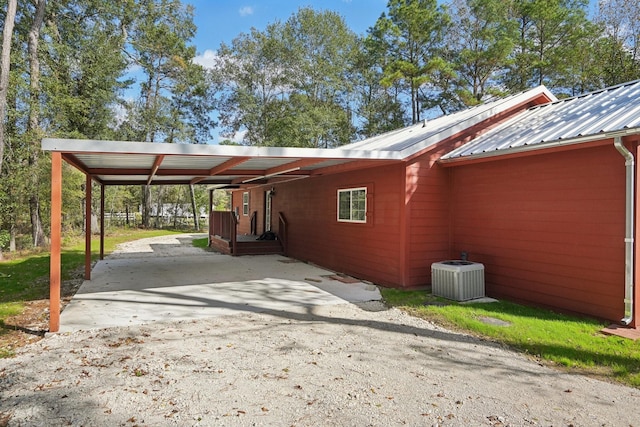 view of parking / parking lot featuring a carport