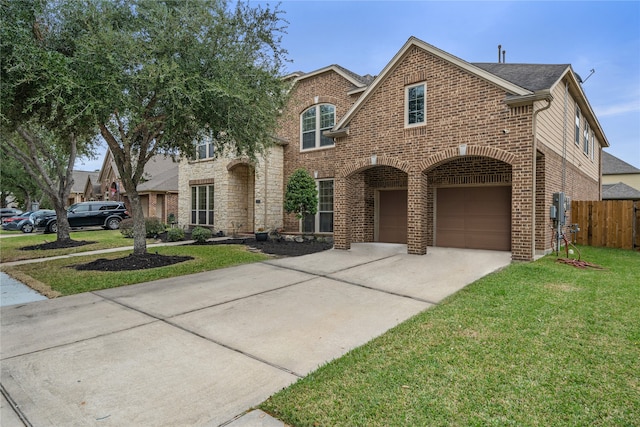 view of front of home featuring a garage and a front lawn