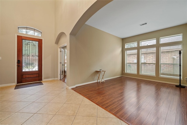 foyer featuring a wealth of natural light and light hardwood / wood-style flooring