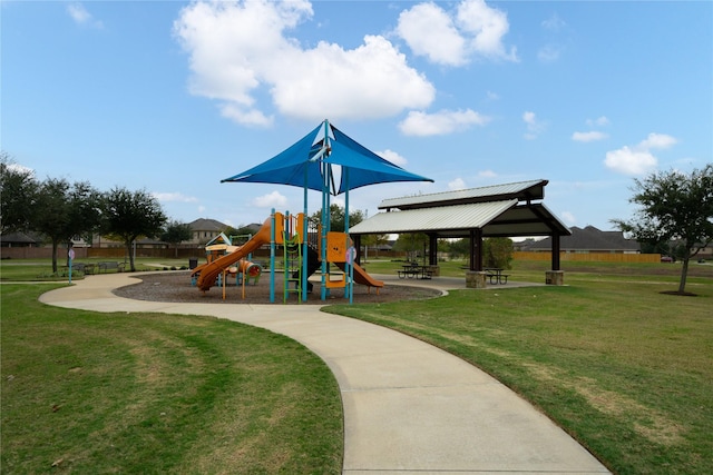 view of jungle gym with a gazebo and a lawn