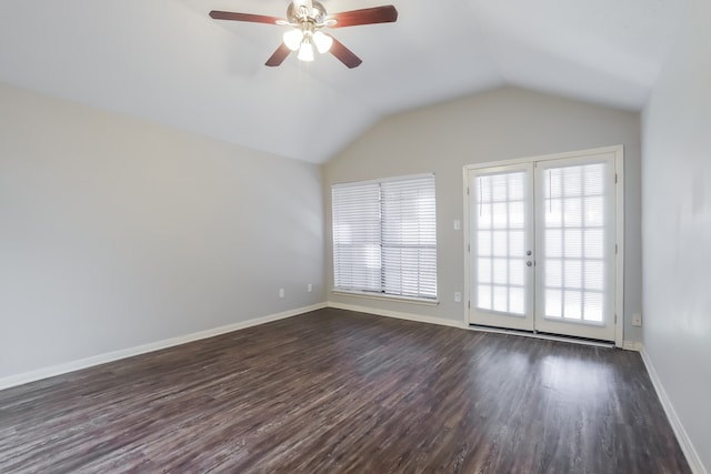 unfurnished room with ceiling fan, dark wood-type flooring, a healthy amount of sunlight, and vaulted ceiling