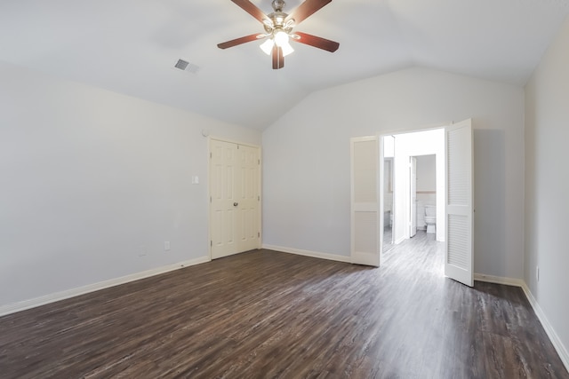 unfurnished room featuring ceiling fan, dark wood-type flooring, and vaulted ceiling