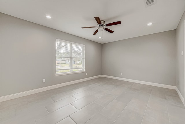 tiled empty room with ceiling fan