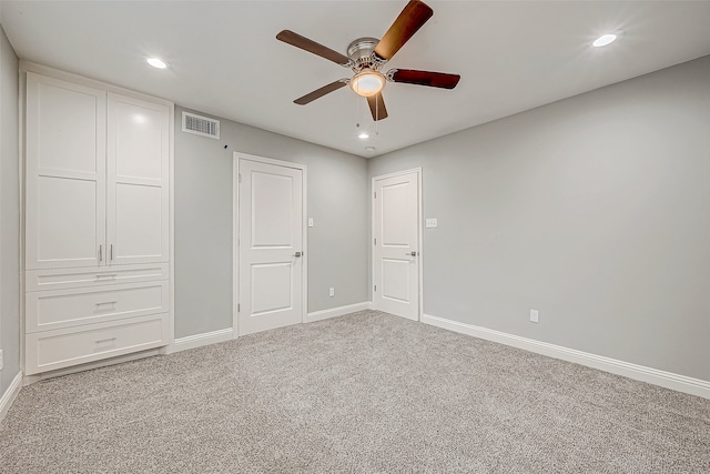 unfurnished bedroom featuring ceiling fan and carpet floors