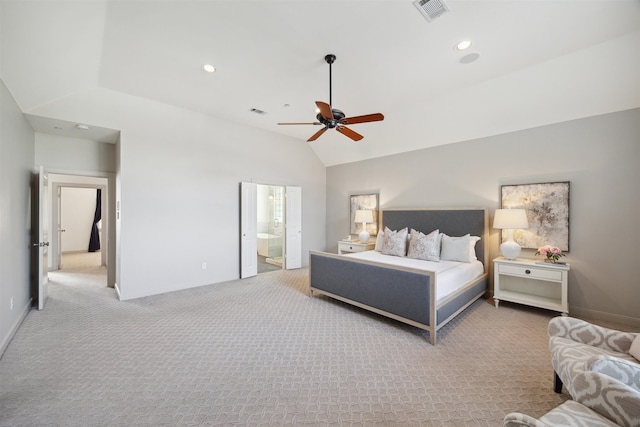 bedroom featuring connected bathroom, light colored carpet, vaulted ceiling, and ceiling fan