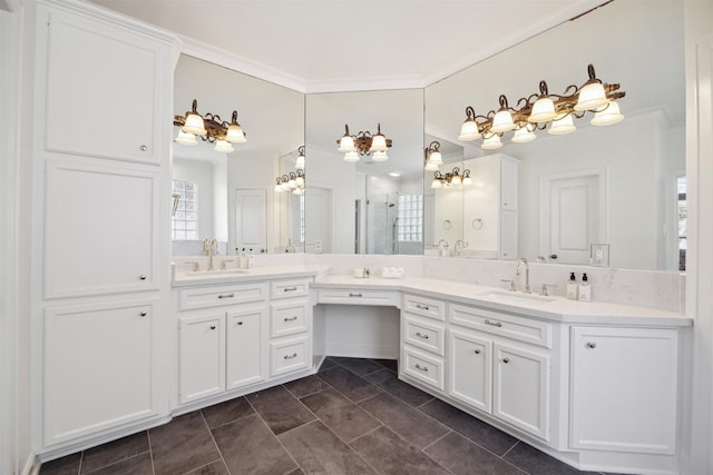 bathroom with vanity, a shower with shower door, and ornamental molding