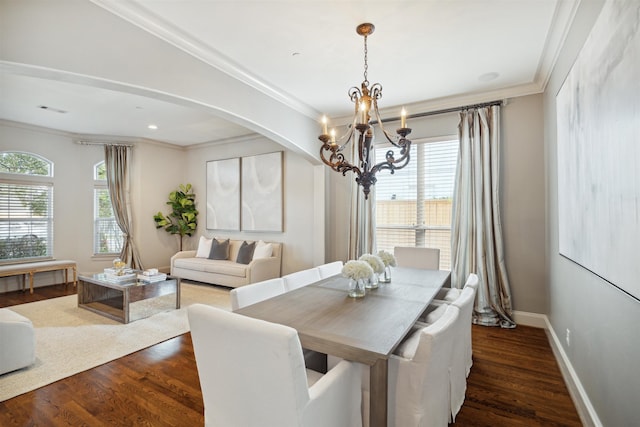 dining space featuring a chandelier, dark hardwood / wood-style flooring, and ornamental molding