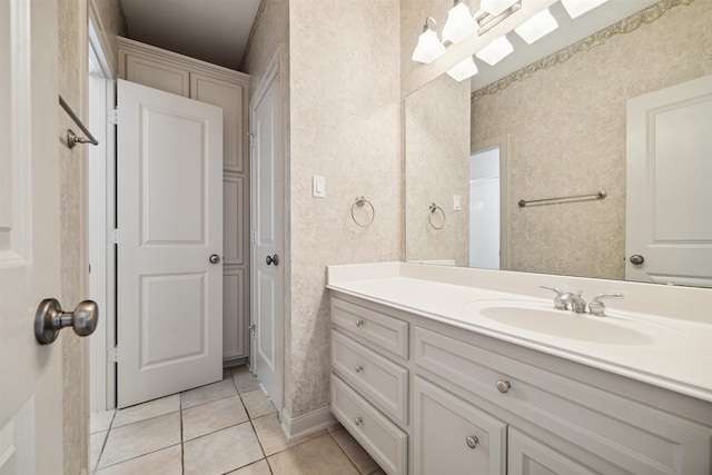 bathroom with tile patterned flooring and vanity