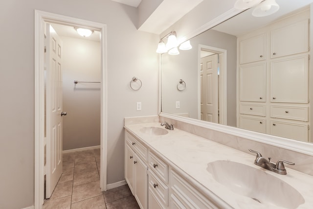 bathroom with tile patterned flooring and vanity