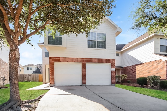 view of front facade with a front yard and a garage