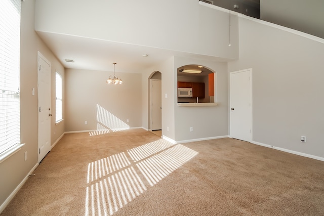 unfurnished living room featuring carpet