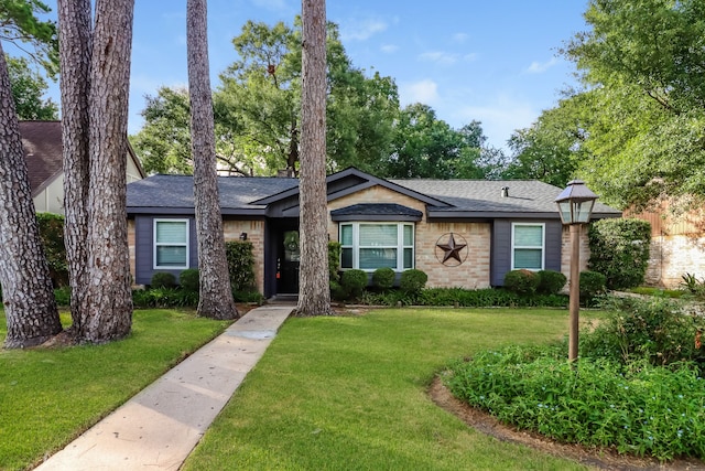 ranch-style house with a front lawn