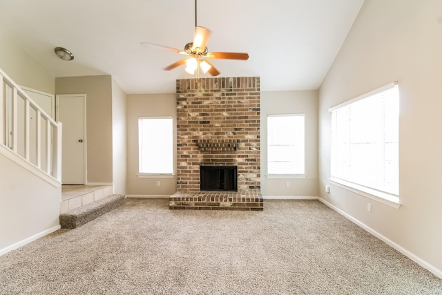 10810 Kirkbend Dr, Houston, TX 77089 - unfurnished living room featuring ceiling fan, stairs, carpet floors, and a fireplace