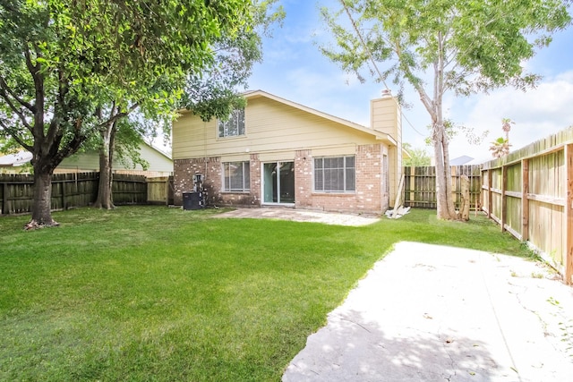 10810 Kirkbend Dr, Houston, TX 77089 - back of property with a patio area, brick siding, a chimney, and central air condition unit