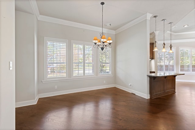 unfurnished dining area featuring a chandelier, dark hardwood / wood-style floors, and ornamental molding