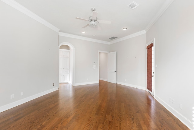 unfurnished room featuring ceiling fan, dark hardwood / wood-style floors, and ornamental molding