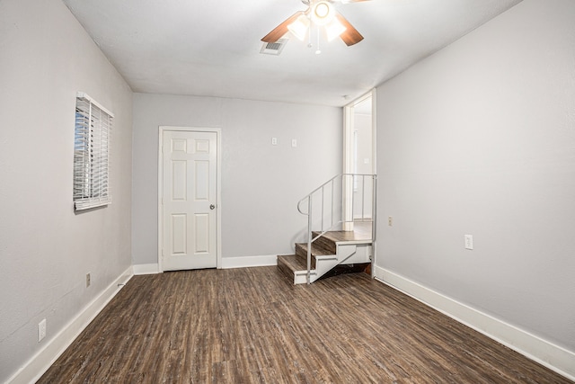 interior space with dark hardwood / wood-style flooring and ceiling fan