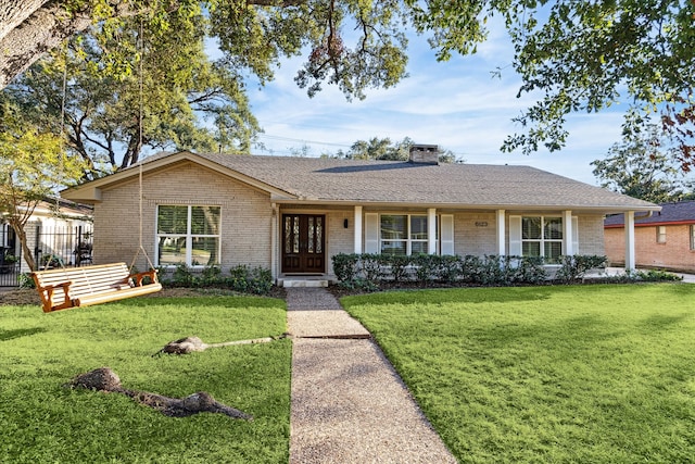 ranch-style house featuring a front yard