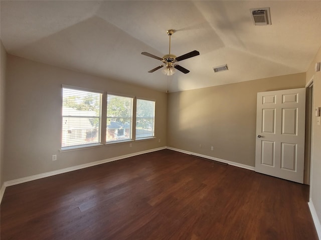 unfurnished room with ceiling fan, dark hardwood / wood-style flooring, and vaulted ceiling