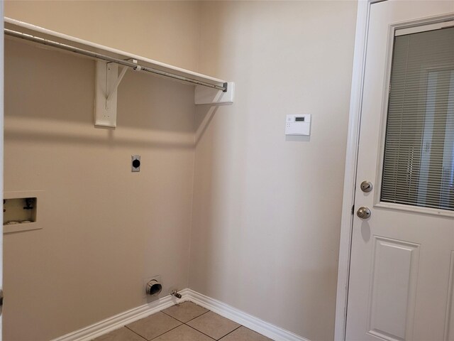 laundry room featuring light tile patterned floors, washer hookup, and hookup for an electric dryer