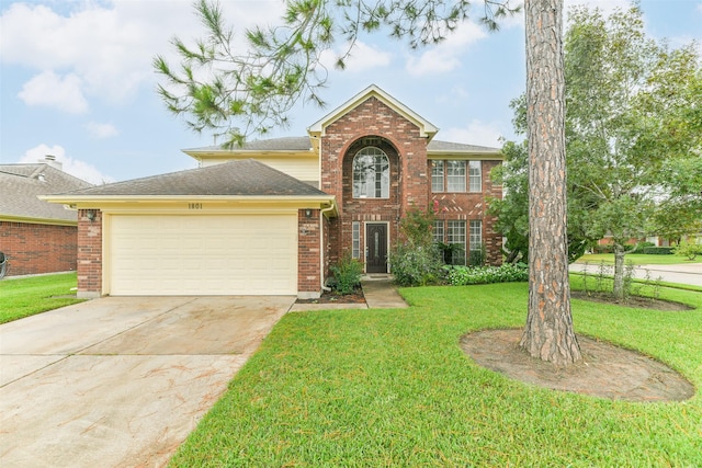 view of property with a garage and a front lawn