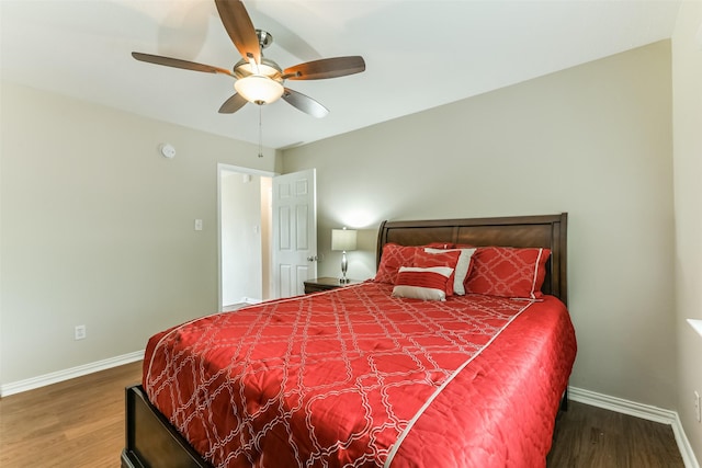 bedroom with hardwood / wood-style floors and ceiling fan