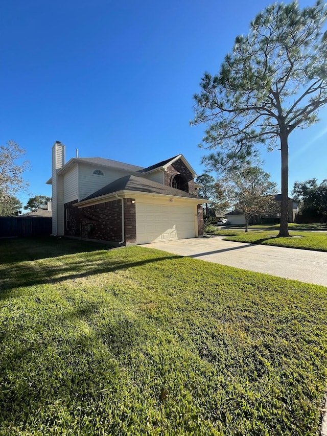 view of side of home with a yard