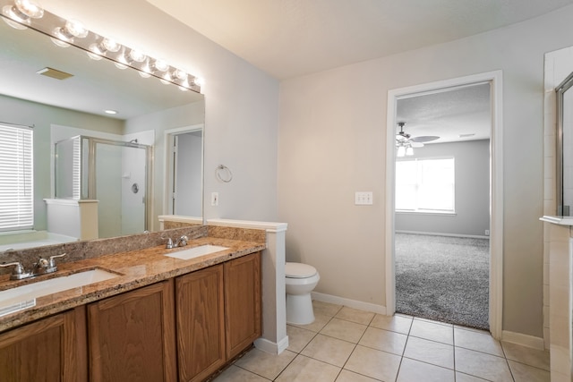 bathroom featuring tile patterned flooring, walk in shower, plenty of natural light, and ceiling fan