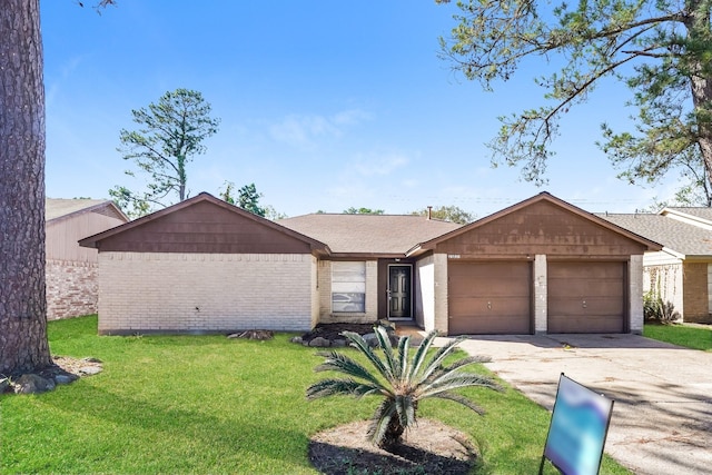 single story home featuring a front lawn and a garage