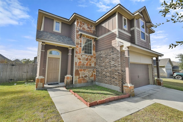 view of front of house featuring a garage and a front lawn