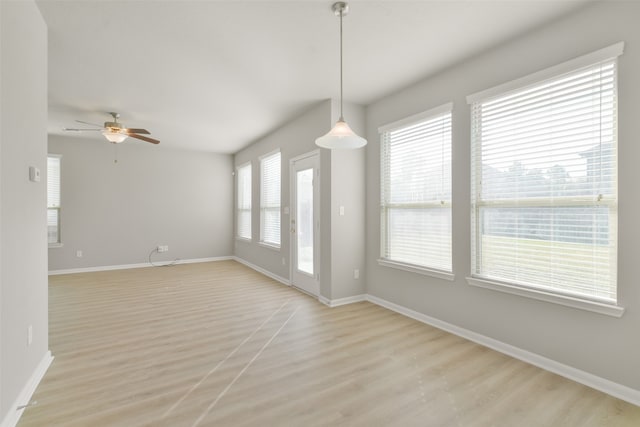 unfurnished room with ceiling fan and light wood-type flooring