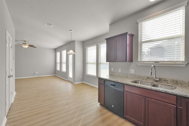 kitchen featuring pendant lighting, sink, ceiling fan, black dishwasher, and light hardwood / wood-style floors