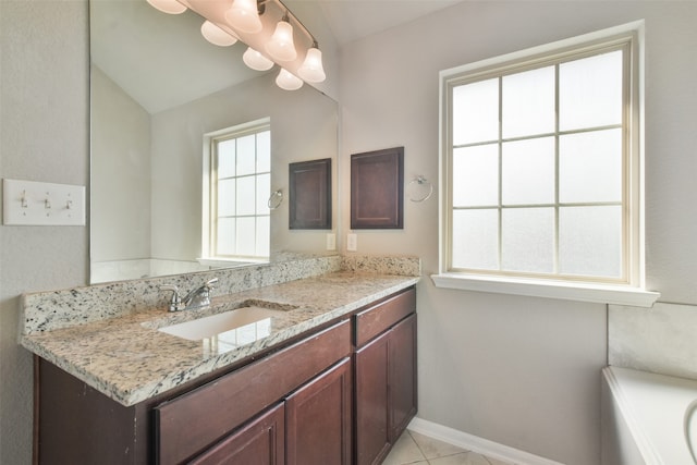 bathroom featuring tile patterned flooring and vanity