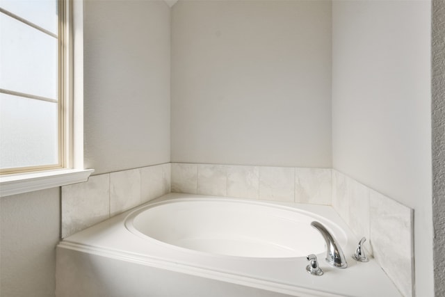 bathroom featuring a tub to relax in