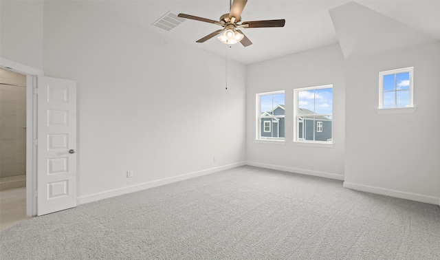 empty room featuring ceiling fan and light carpet