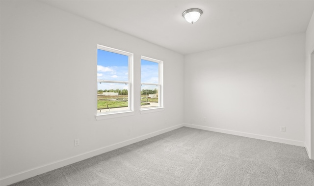 unfurnished room featuring carpet floors