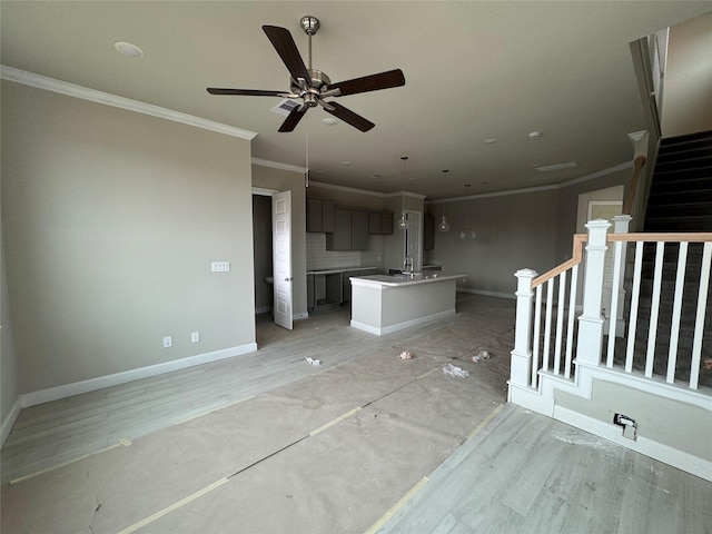 unfurnished living room featuring crown molding, light hardwood / wood-style floors, and ceiling fan