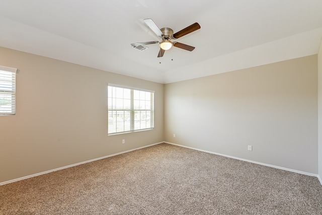 empty room featuring carpet floors and a healthy amount of sunlight